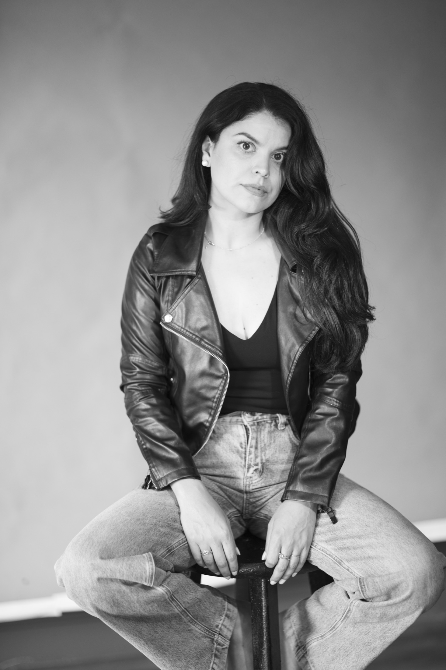 Black and white fashion portrait of Kimberly in a leather jacket