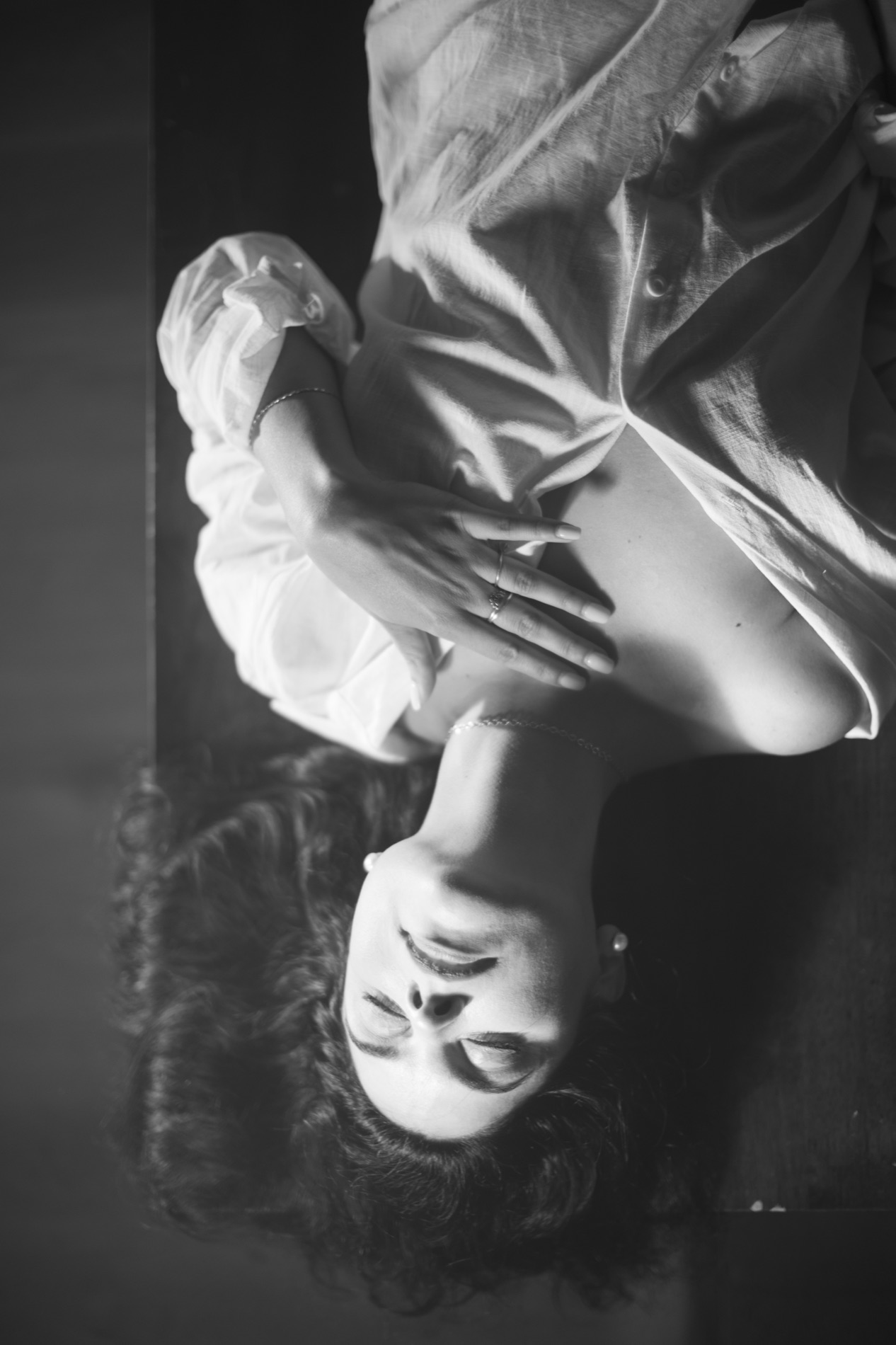 Abstract black and white portrait of Kimberly in an oversized shirt